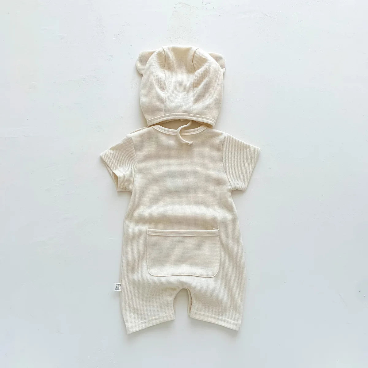 Nuevo en verano, monos para niños y niñas de manga corta con parche de gofre, monos para recién nacidos, pelele de algodón, sombrero de regalo con oreja